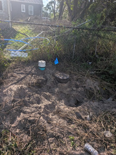 Residential sewer repair work in a side yard